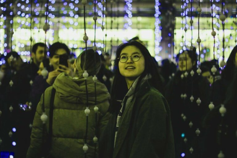 woman looking up at digital signage content